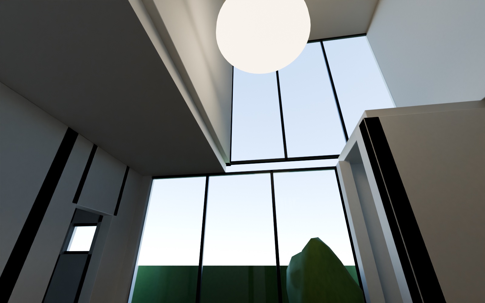Inside the double-height living room in the north-east, looking up at the full-height north glass wall